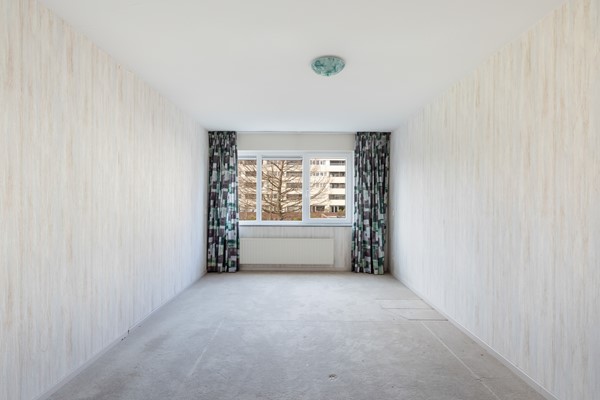 Foto - Te koop: Ruime dubbele benedenwoning met parkeerplaats!